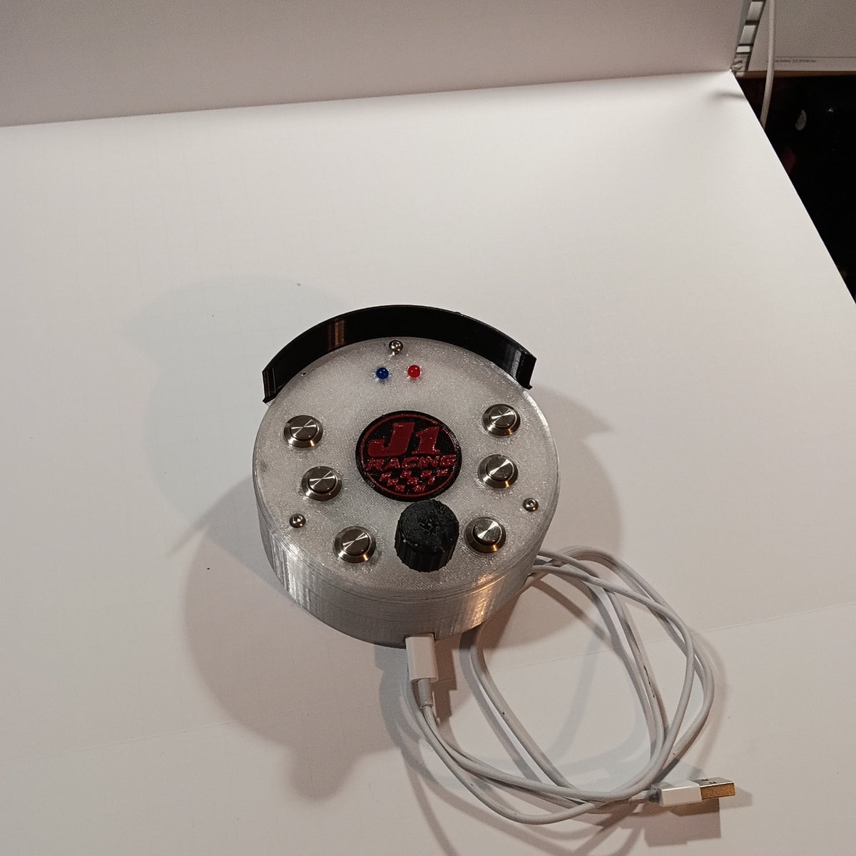 J1 SS white round USB button box photographed on a white backdrop