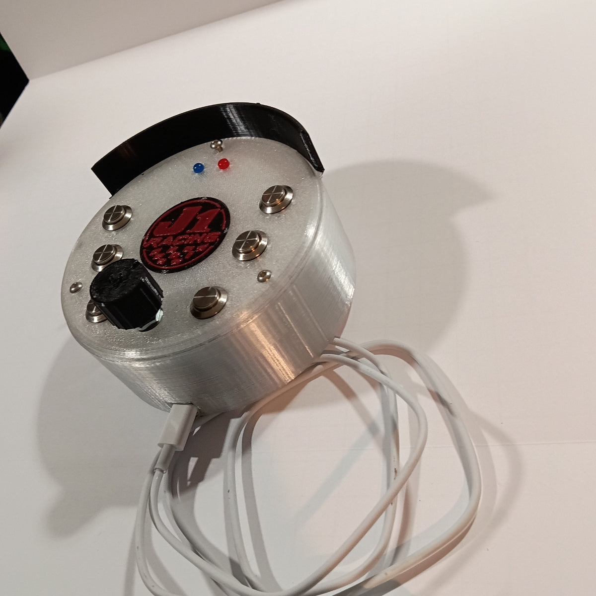 J1 SS white round USB button box photographed on a white backdrop