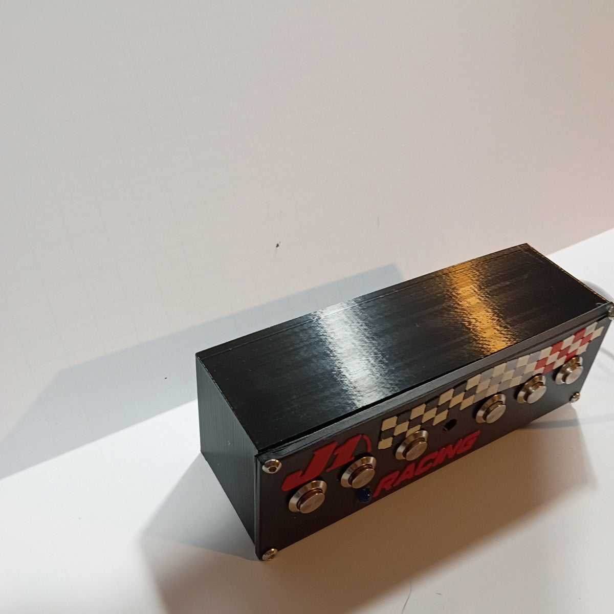 J1 S6.6B black USB button box on a white backdrop